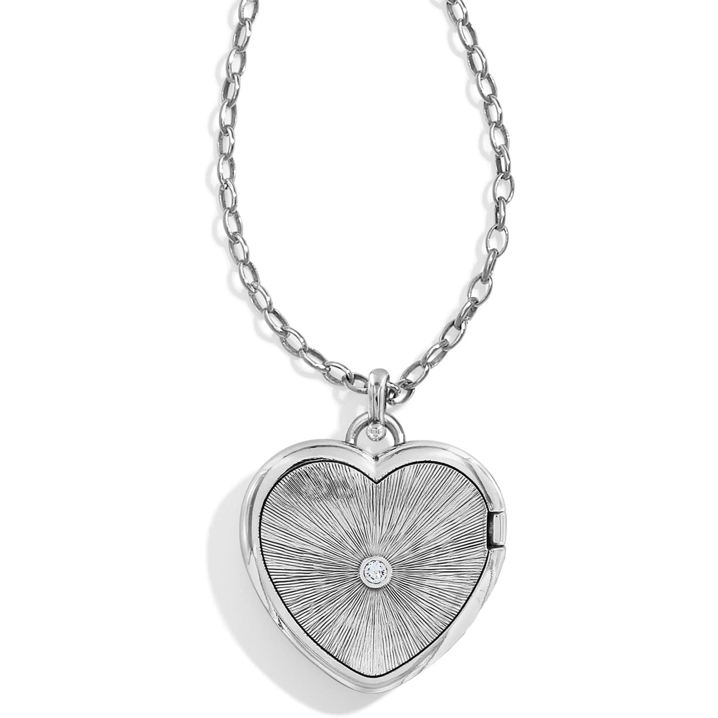 Brighton heart locket necklace with silver-plated sunburst engraved pendant, crystal center, and chain on a white background