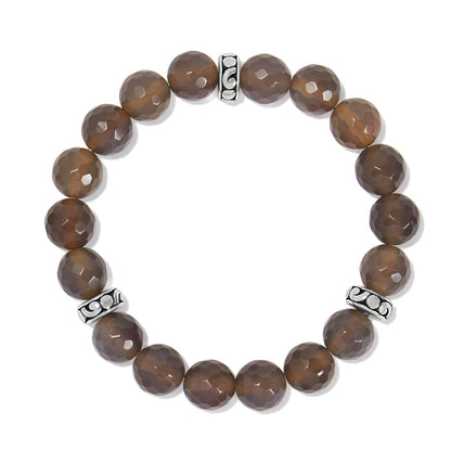 Brighton beaded stretch bracelet with faceted brown stones and silver-plated scrollwork spacer accents on a white background