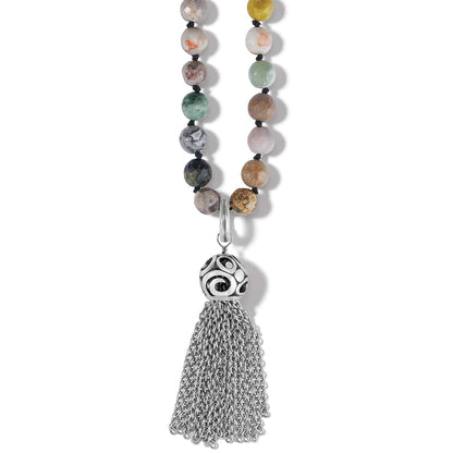 Brighton beaded necklace with multicolor jasper and agate stones and silver-plated tassel pendant on a white background