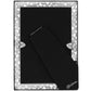 Brighton picture frame shown from the back with silver-plated scroll cutout border and black velvet easel stand on a white background