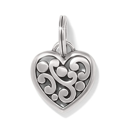 Brighton heart charm with silver-tone scroll and dot openwork design and split ring on a white background