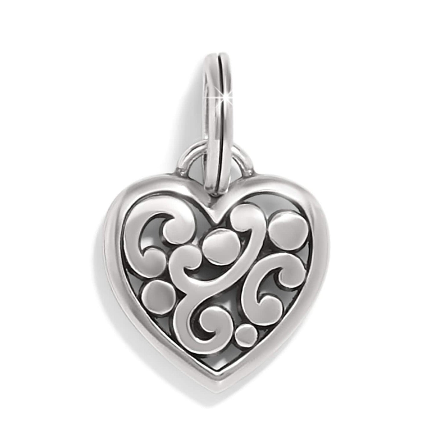 Brighton heart charm with silver-tone scroll and dot openwork design and split ring on a white background