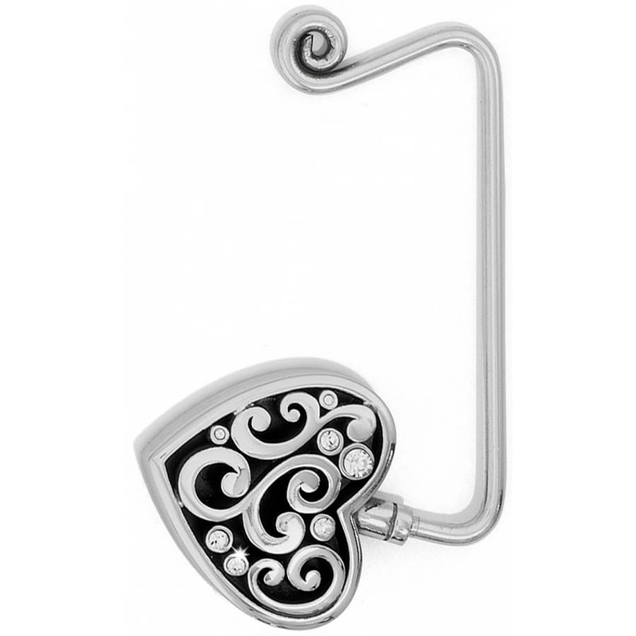 Brighton handbag hook with silver-tone heart medallion, scroll design, and crystal accents on a white background