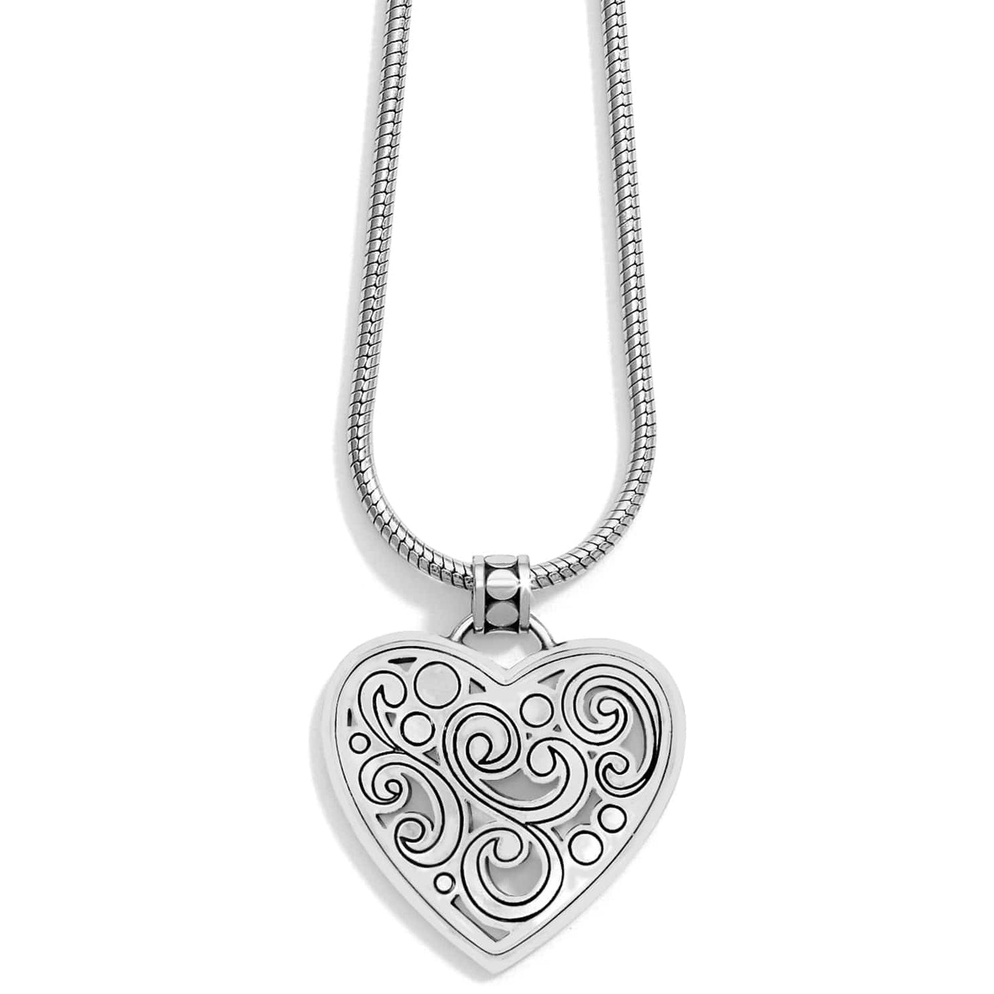 Brighton pendant necklace with silver-plated heart featuring swirl and dot cutout design on snake chain on a white background