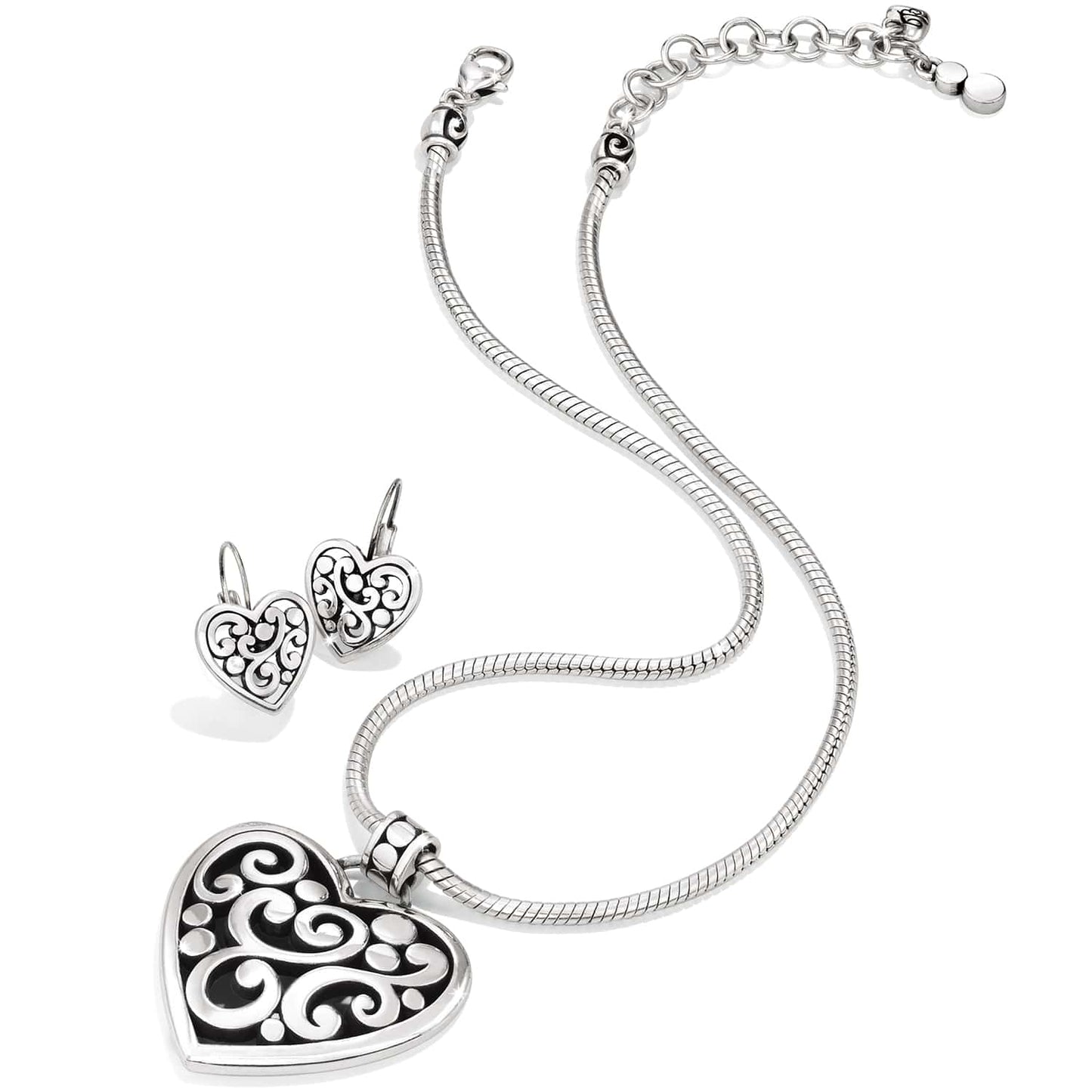 Brighton silver-plated heart pendant necklace with matching scroll-patterned drop earrings on a white background