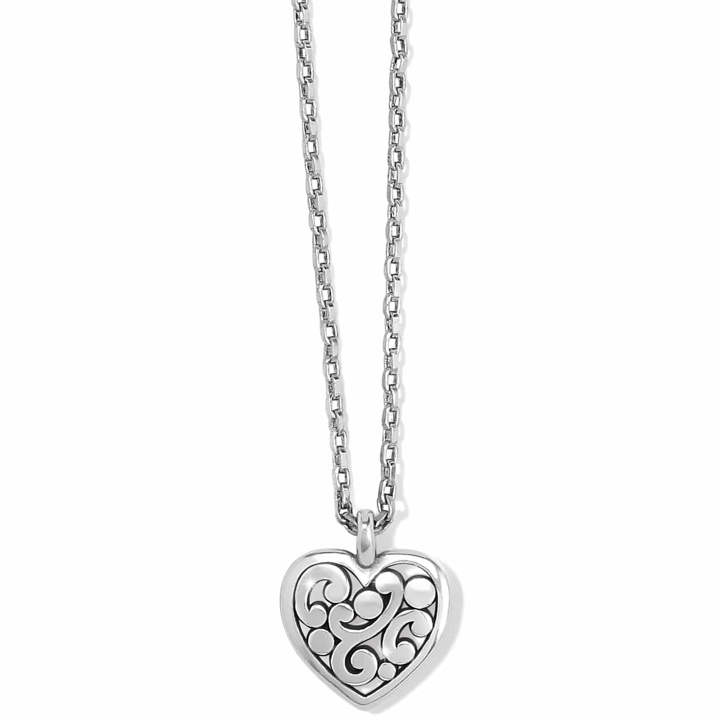 Brighton pendant necklace with silver-plated heart featuring scroll and dot openwork design on a white background