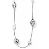 Brighton station necklace with silver-plated oval scroll medallions and round bead accents on a white background