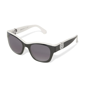 Brighton sunglasses with black and white frames, gray lenses, and silver-tone scrollwork medallions on a white background