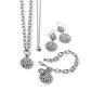 Brighton silver-tone jewelry set styled with matching scroll medallion necklace, bracelet, drop earrings, and pendant on white background