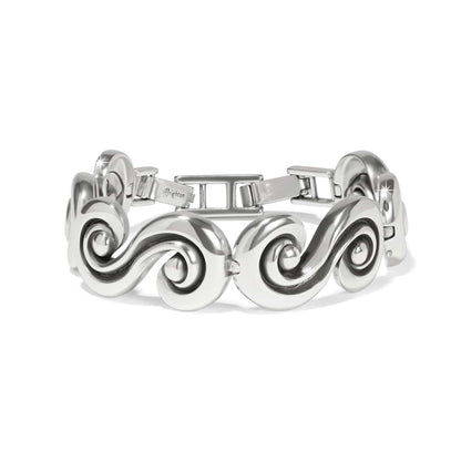 Brighton bracelet with silver-plated swirling wave links and hinged clasp on a white background