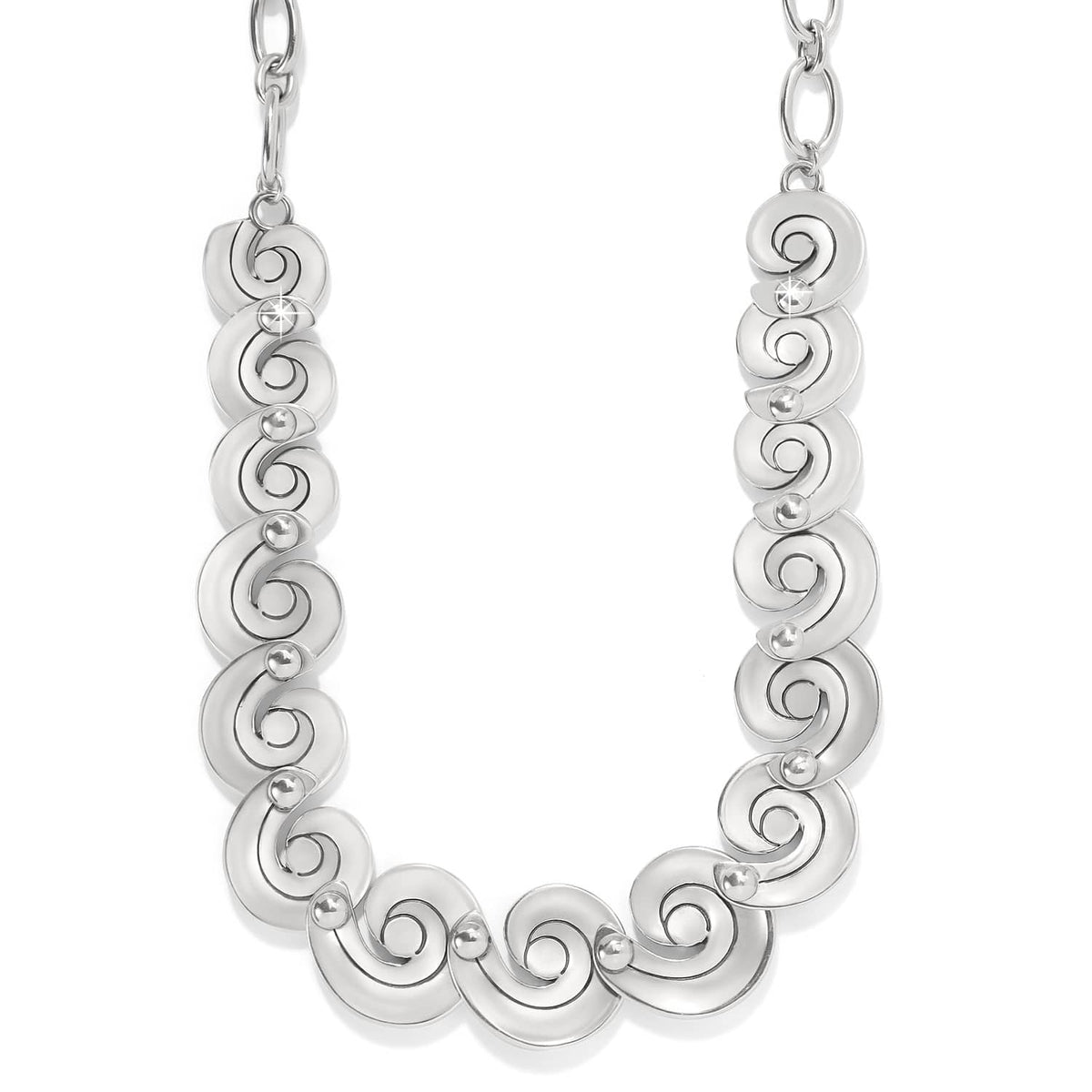 Brighton silver-plated necklace with linked swirl motifs and small bead accents on a white background