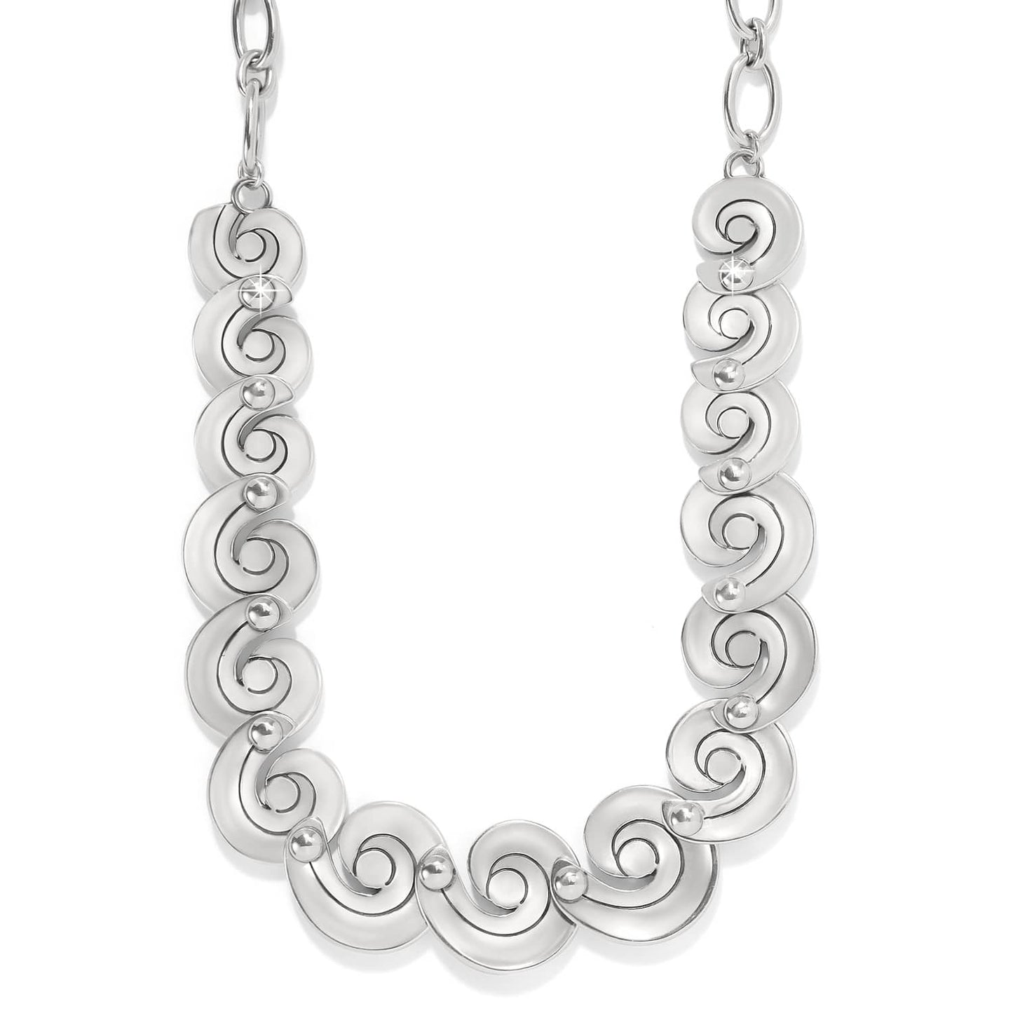 Brighton silver-plated necklace with linked swirl motifs and small bead accents on a white background