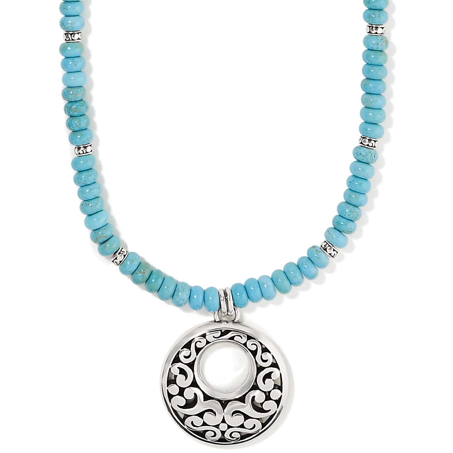 Brighton pendant necklace with turquoise dyed howlite beads and silver-plated openwork medallion on a white background
