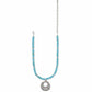 Brighton beaded necklace with turquoise dyed howlite beads, silver-plated scroll pendant, and chain on a white background