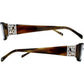 Brighton eyeglasses side view showing brown tortoise temples with silver-tone scroll medallion accents on a white background