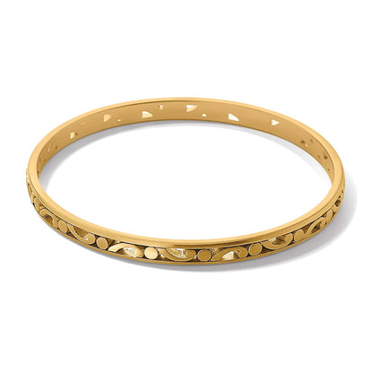 Brighton bangle bracelet with gold-plated finish and engraved scroll pattern detailing along the exterior on a white background