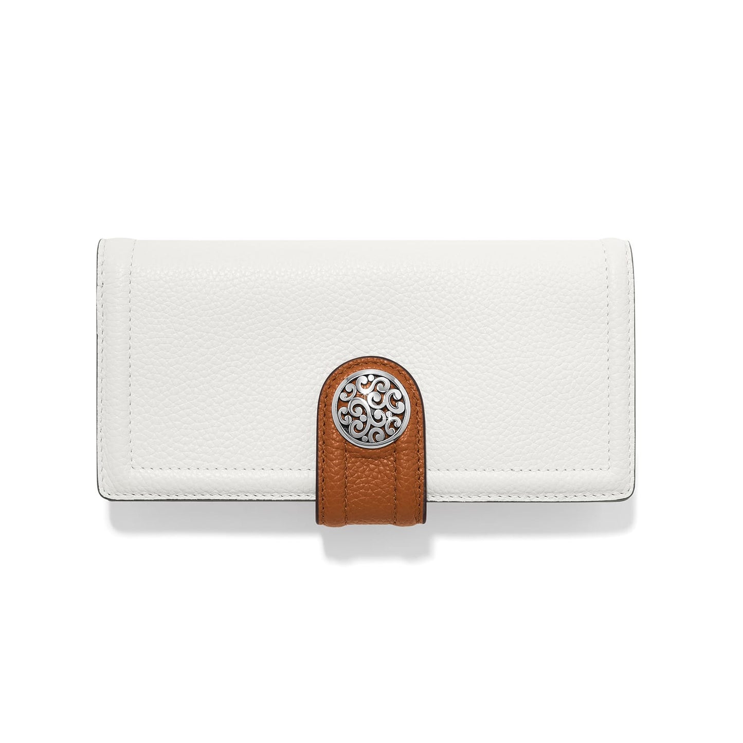 Brighton white leather wallet with brown tab closure and silver-tone scrollwork medallion on a white background