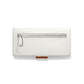 Brighton wallet shown from the back with white pebbled leather, silver-tone zip pocket, and tan tab on a white background