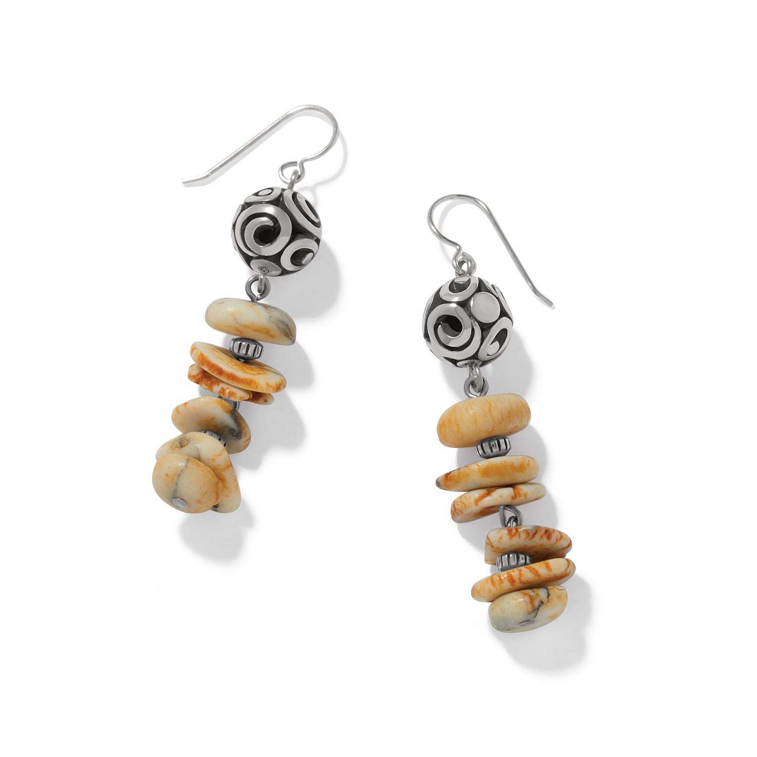 Brighton drop earrings with silver-plated swirl beads and stacked cream and orange disk beads on a white background