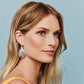 Model wearing a Brighton silver-plated teardrop earring with openwork scroll and dot design