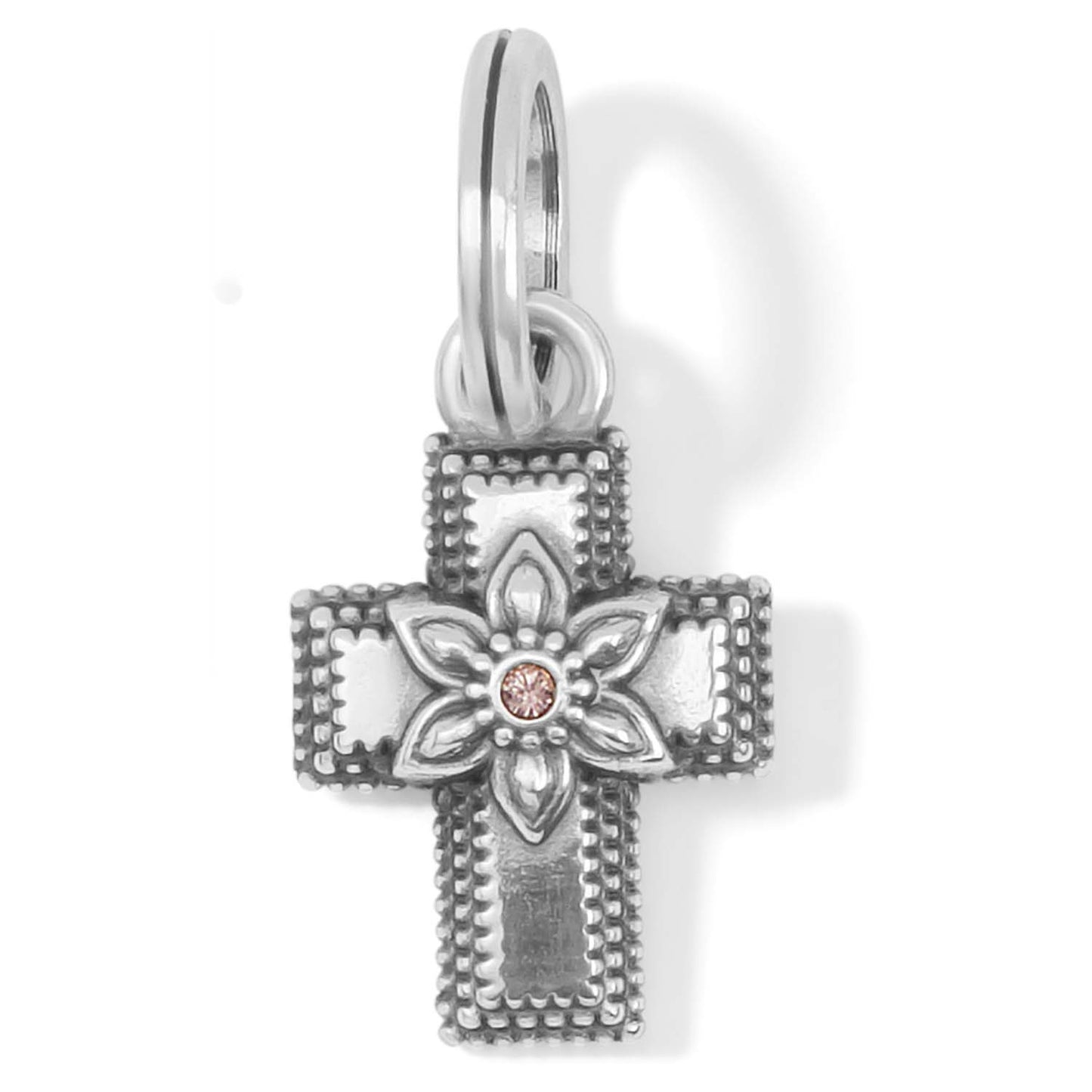 Brighton cross charm in silver-plated finish with floral center design and pink crystal accent on a white background