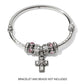 Brighton silver-plated cross charm with flower detail and crystal center, displayed on bangle with beads, on a white background