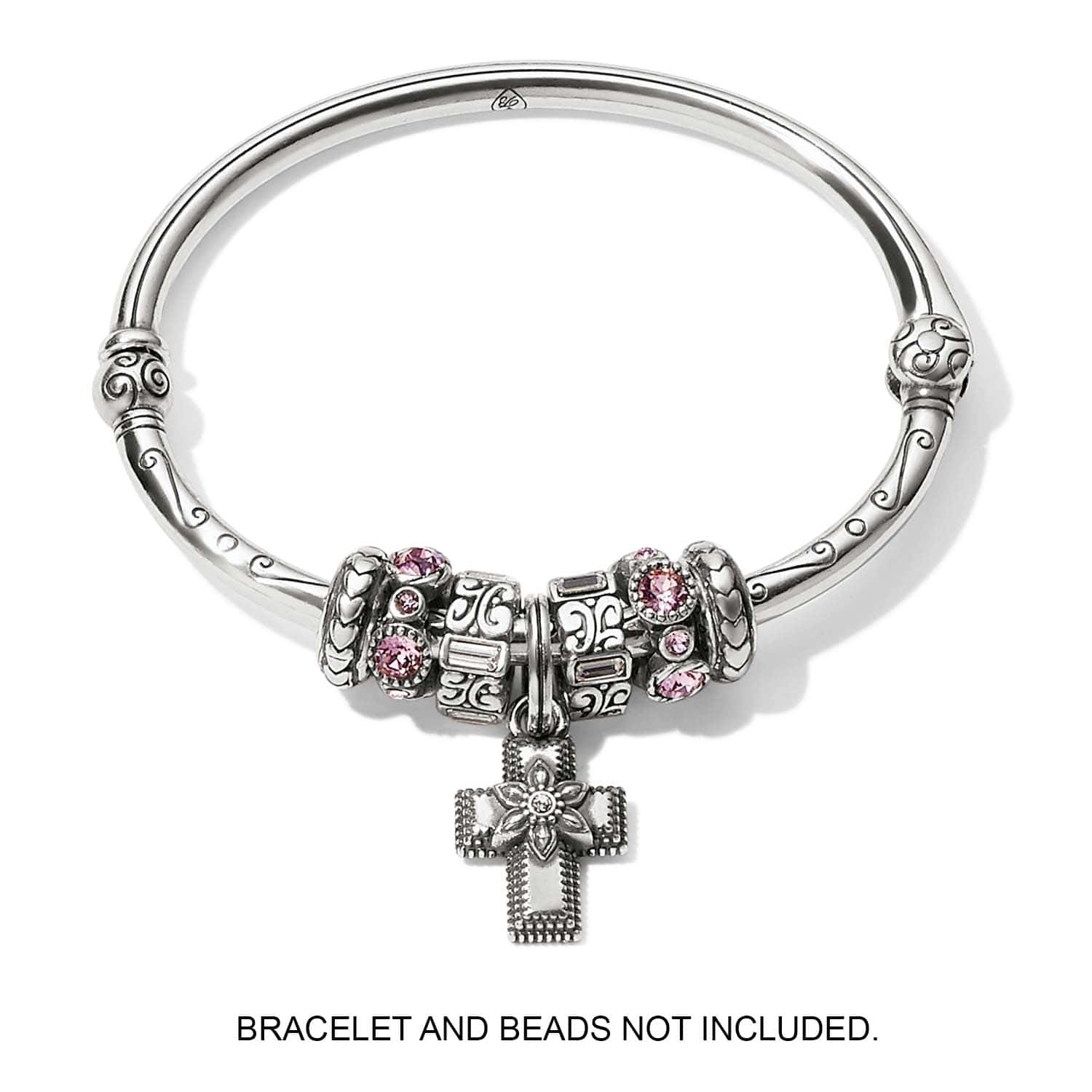 Brighton silver-plated cross charm with flower detail and crystal center, displayed on bangle with beads, on a white background