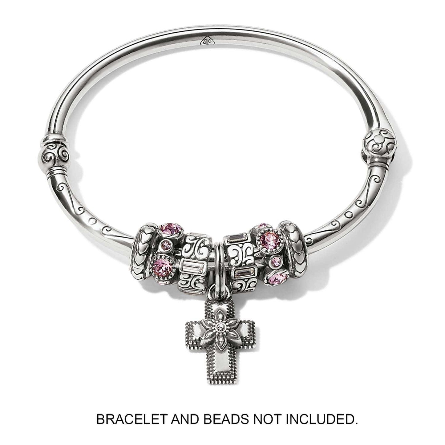 Brighton silver-plated cross charm with flower detail and crystal center, displayed on bangle with beads, on a white background