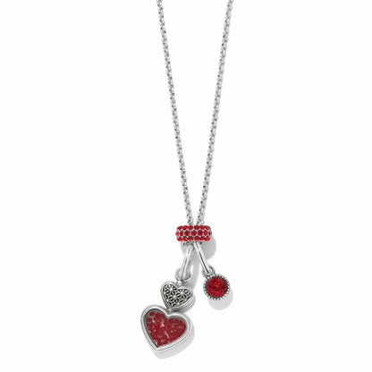 Brighton charm necklace with silver-plated heart charms and red crystal accents on a white background