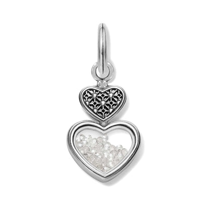 Brighton double heart charm with silver-plated filigree top and clear crystals inside lower heart on a white background