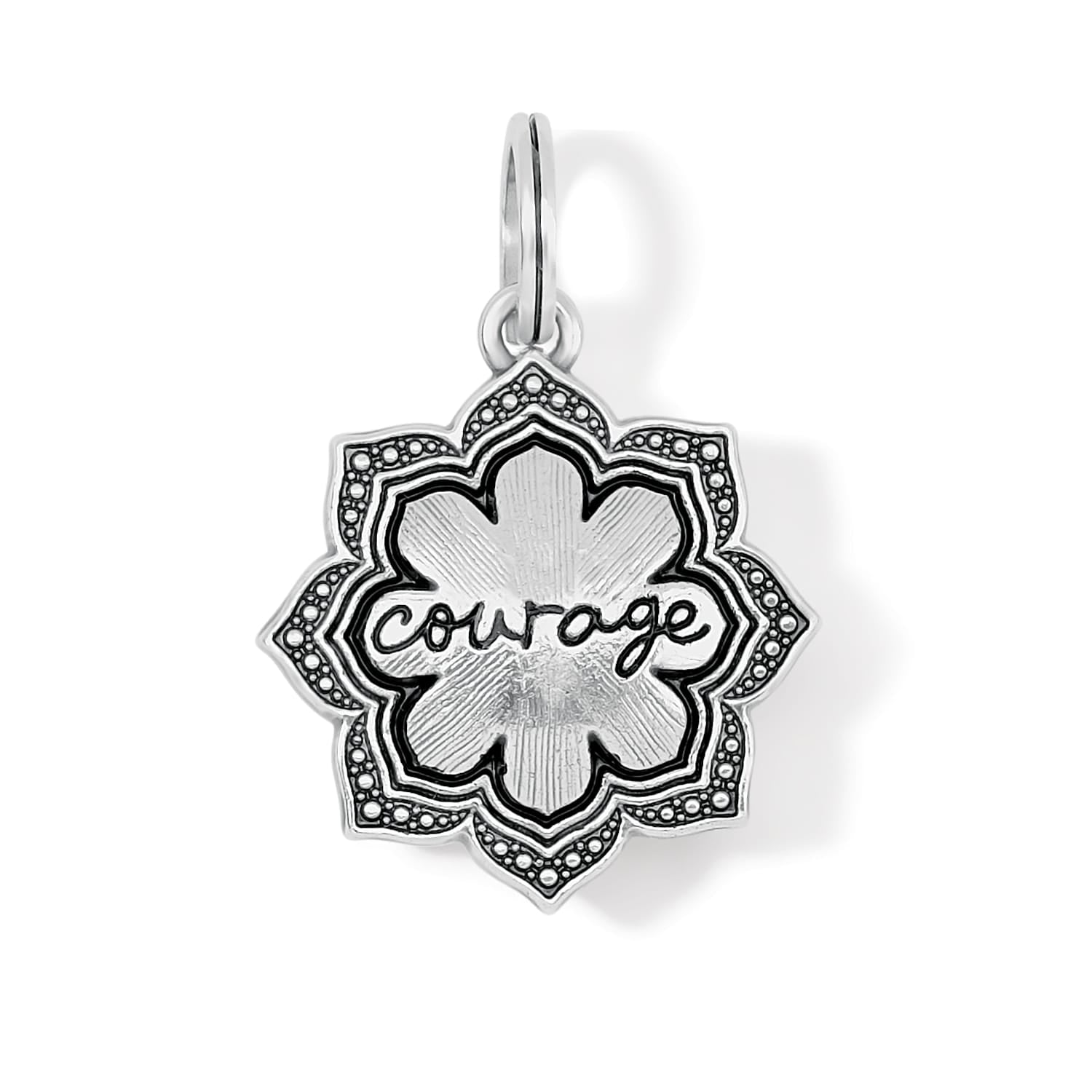Brighton charm with silver-plated lotus flower design and engraved courage script in center on a white background