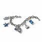 Brighton silver-plated charm bracelet with starfish, sailboat, anchor heart, flip-flop, and blue crystal charms on a white background