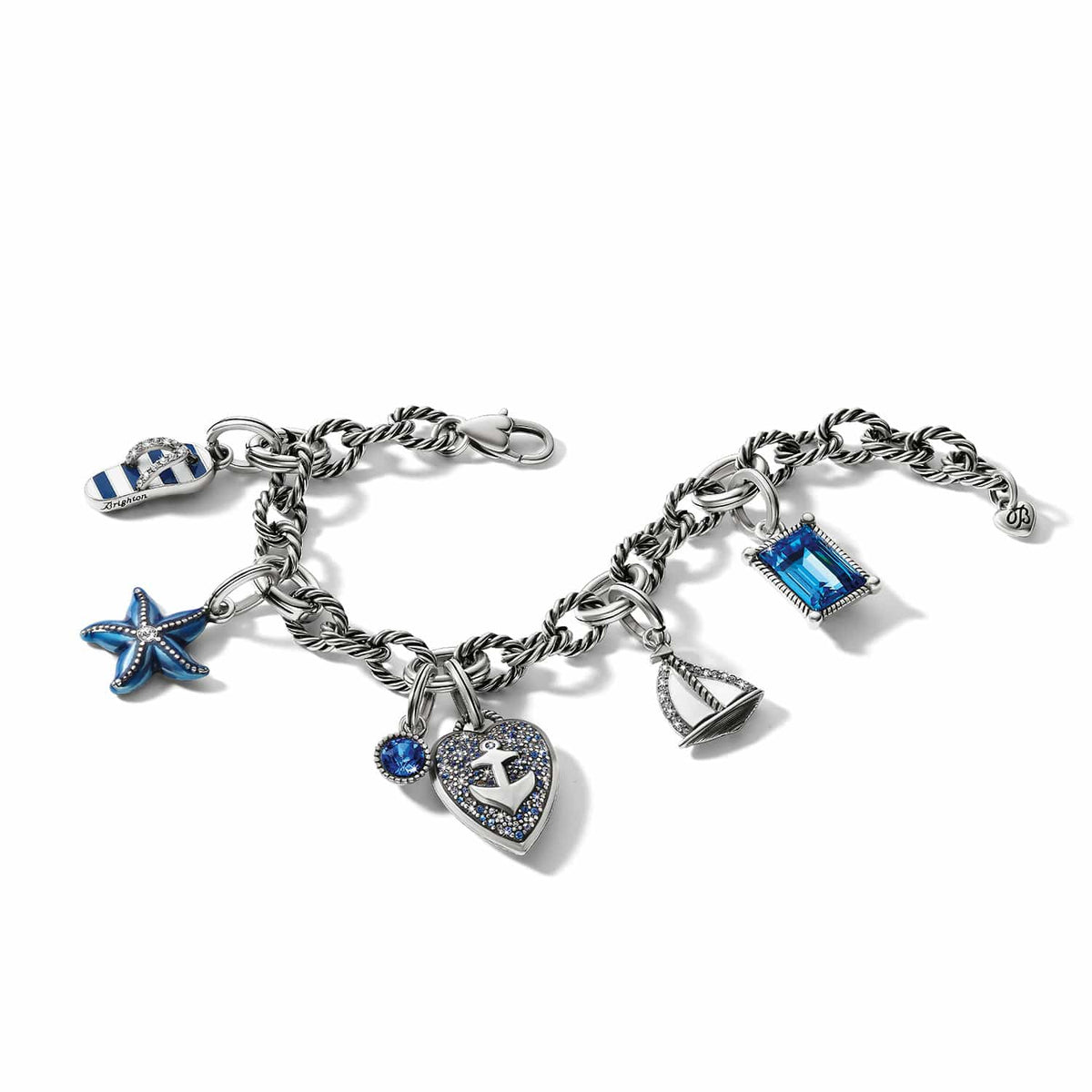 Brighton silver-plated charm bracelet with starfish, sailboat, anchor heart, flip-flop, and blue crystal charms on a white background