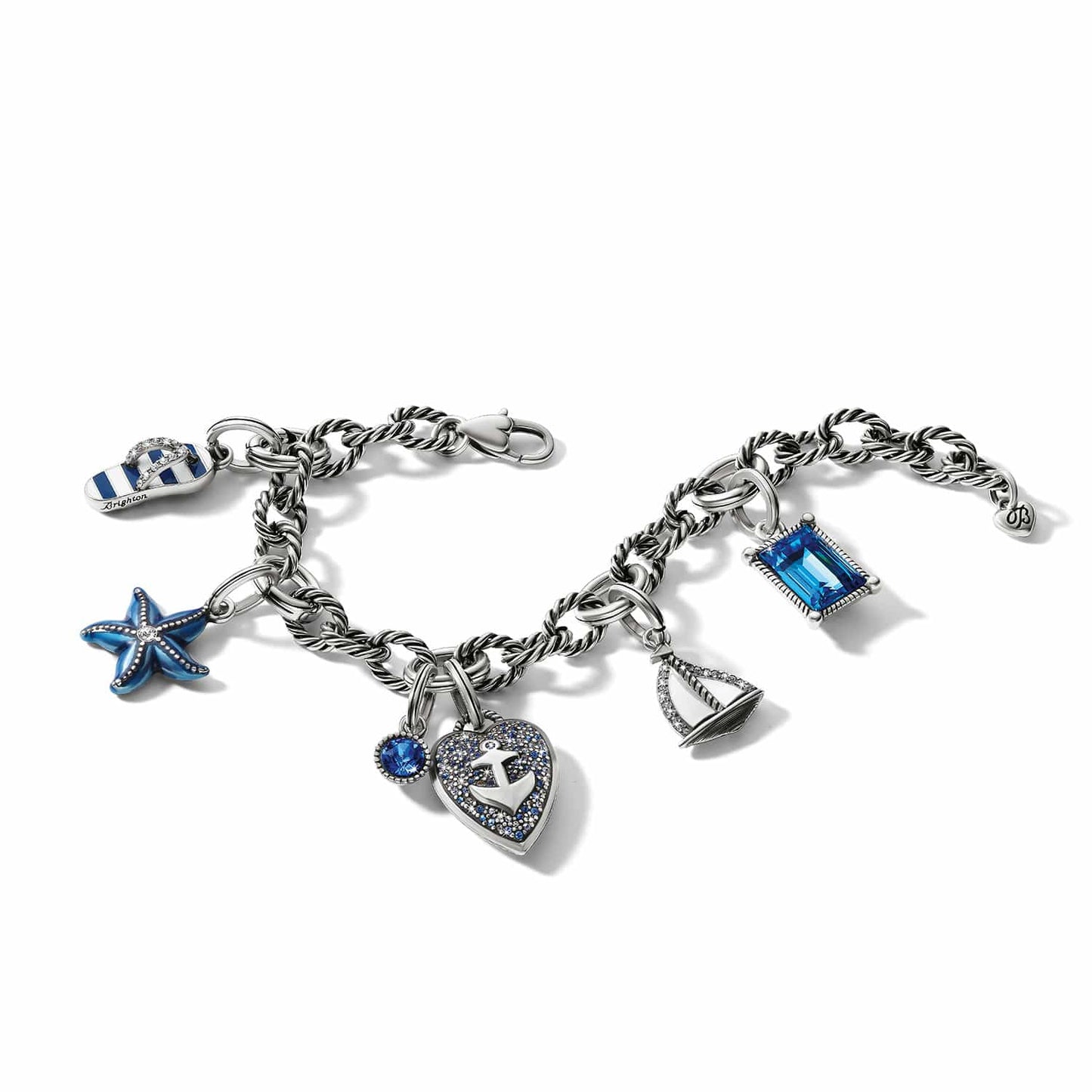 Brighton silver-plated charm bracelet with starfish, sailboat, anchor heart, flip-flop, and blue crystal charms on a white background