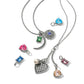 Brighton silver-plated necklaces styled with assorted crystal charms in pink, blue, green, and amber on white background