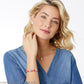 Model wearing a Brighton pink leather bracelet with silver-plated crystal charms and coordinating Brighton accessories