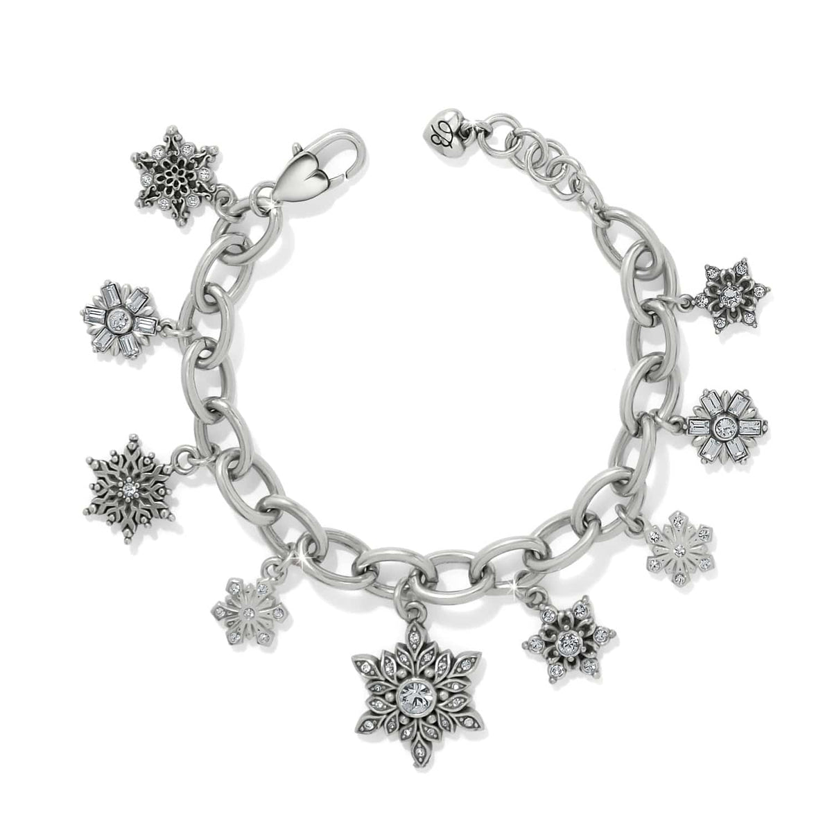 Brighton charm bracelet with silver-plated snowflake charms and crystal accents on a chain link band on a white background