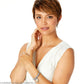 Model wearing a Brighton silver-plated charm bracelet with textured beads and a round dangling charm