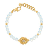 Brighton beaded bracelet with opalescent beads, gold-plated flower centerpiece with crystals, and lobster clasp on a white background