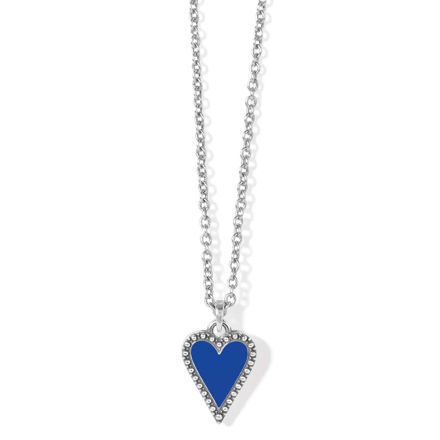 Brighton pendant necklace with blue enamel heart, silver-plated beaded border, and rolo chain on a white background