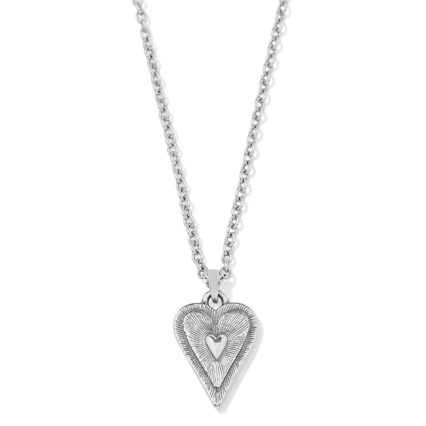 Brighton heart pendant necklace with silver-plated textured charm and small raised heart center on a white background