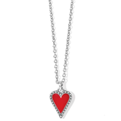 Brighton pendant necklace with red enamel heart, silver-plated beaded border, and rolo chain on a white background