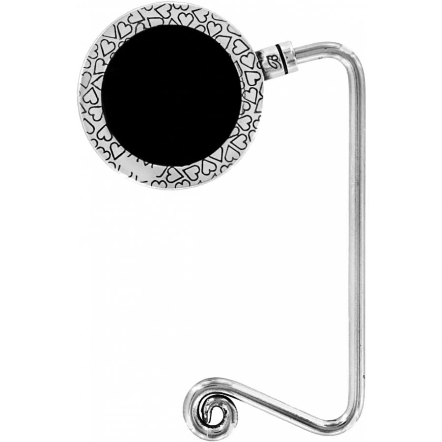 Brighton silver-tone handbag hook with heart-patterned round disc and curled hook end on a white background