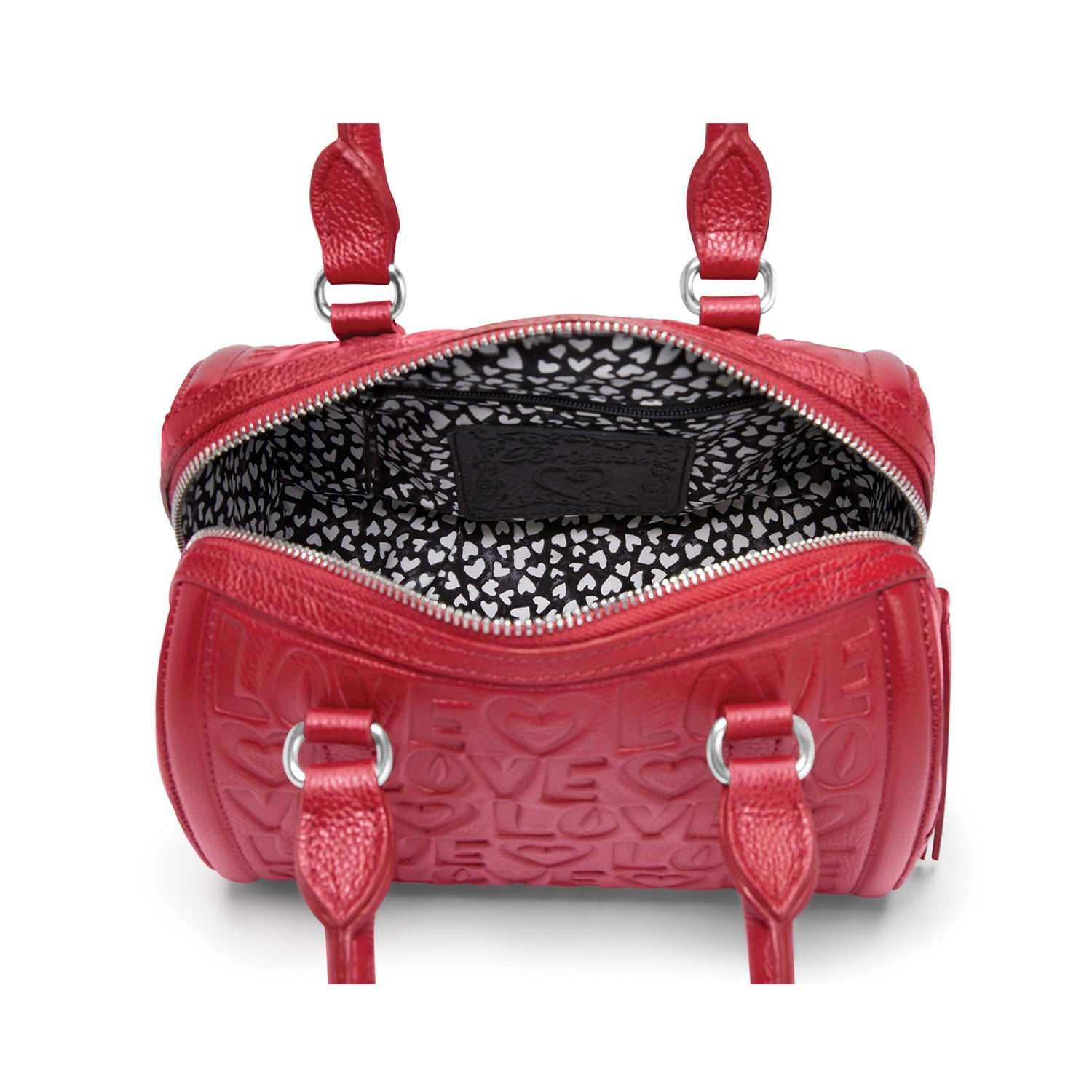 Close-up of Brighton red leather handbag shown open with black heart-print interior lining and embossed love motif