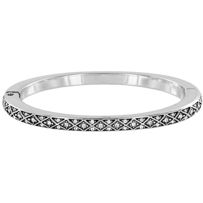 Brighton bangle bracelet with silver-plated finish, crisscross pattern, and crystal accents on a white background
