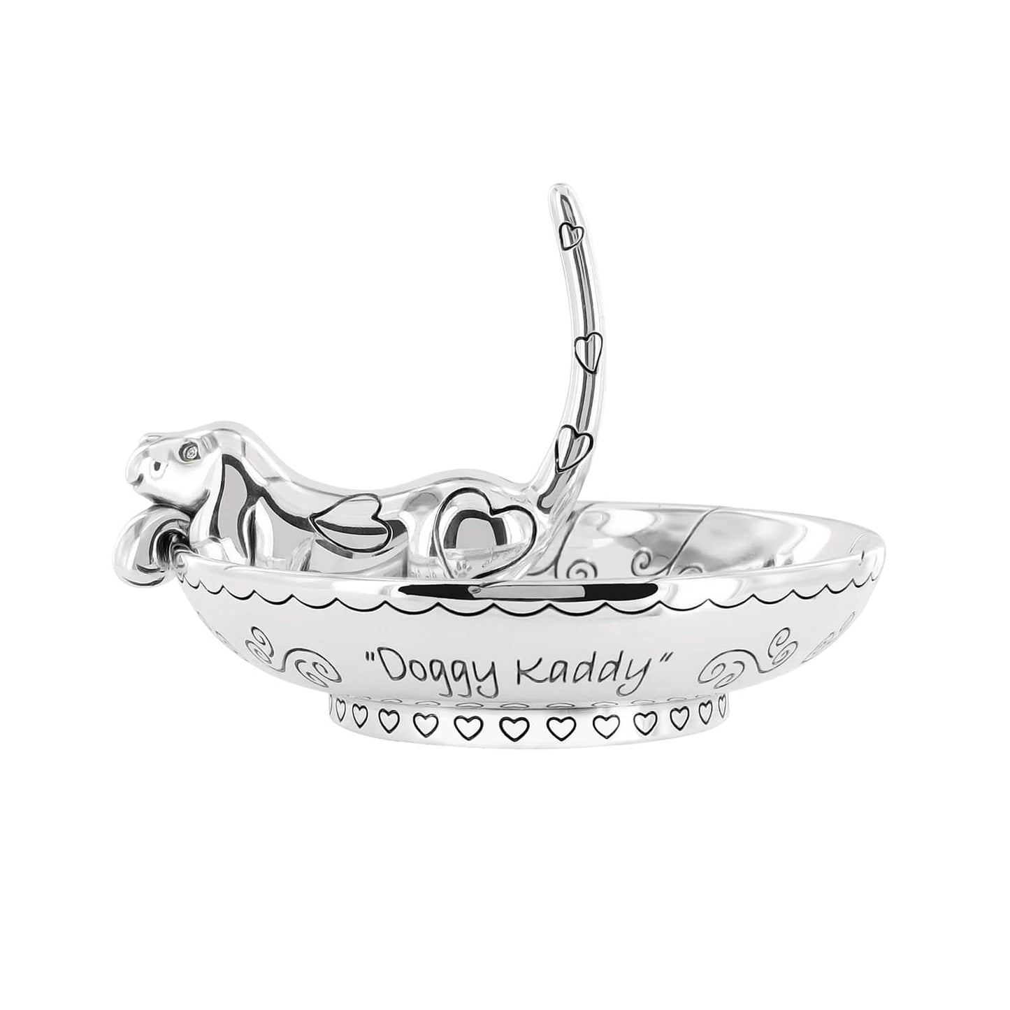 Brighton silver-plated ring holder dish with reclining dog figure, heart accents, and "Doggy Kaddy" engraving on a white background
