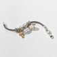 Brighton charm bracelet with gold-plated cross, faith medallion, enamel egg charm, and crystal spacers on a white background