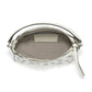 Brighton white leather handbag shown open with patterned fabric lining, embossed logo tag, and silver-tone studs on a white background