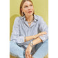 Model wearing a Brighton silver-plated chain link necklace with coordinating Brighton accessories including hoop earrings and bracelets