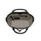 Close-up of Brighton handbag interior view with patterned fabric lining, zippered pocket, and black leather handles